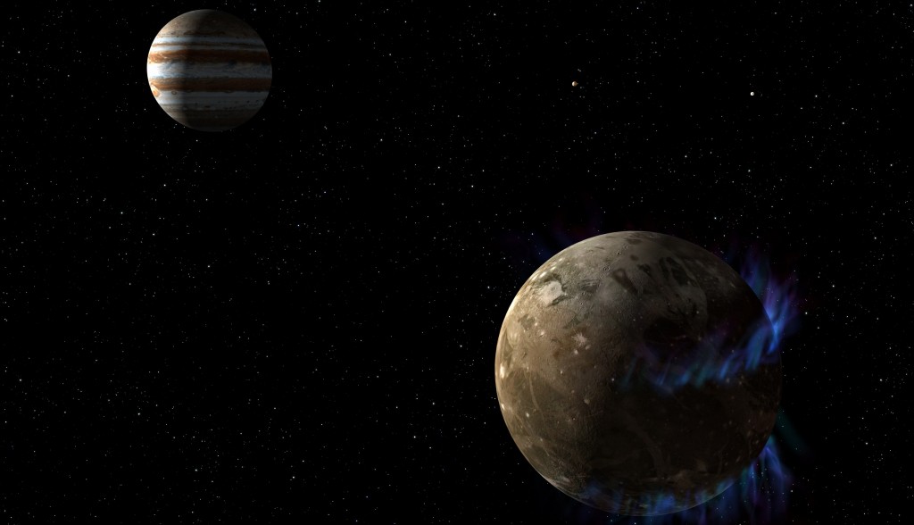 Illustrasjon Ganymedes med polarlys. Jupiter i bakgrunnen. Klikk for større versjon. Illustrasjon: NASA, ESA, G. Bacon (STScI)