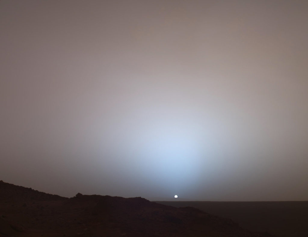 On May 19th, 2005, NASA's Mars Exploration Rover Spirit captured this stunning view as the Sun sank below the rim of Gusev crater on Mars. (Image Credit: NASA/JPL-Caltech/Texas A&M/Cornell)
